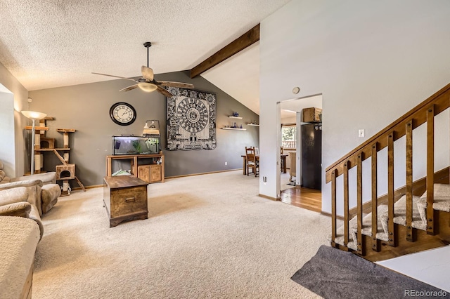 living room featuring carpet, a ceiling fan, stairway, baseboards, and a textured ceiling