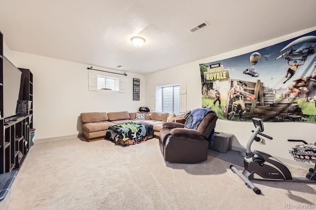 carpeted living room featuring baseboards