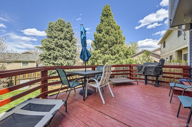 deck with outdoor dining area