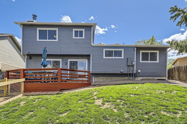back of house featuring a wooden deck