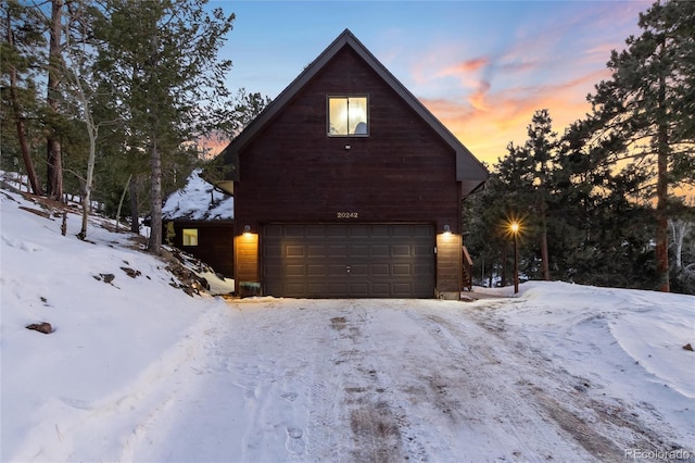 front facade with a garage