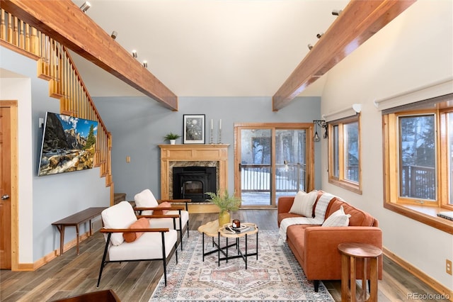 living room with wood-type flooring and lofted ceiling with beams