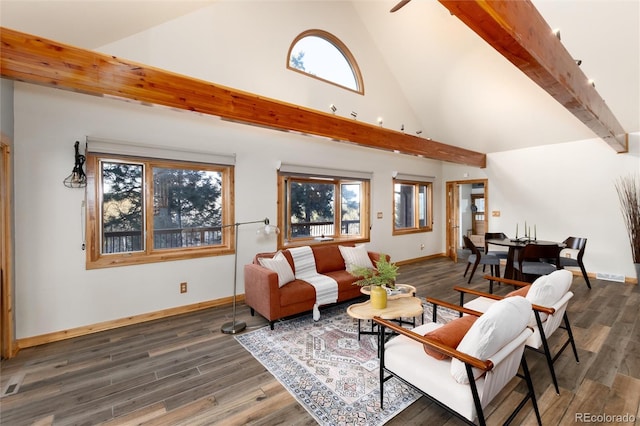 living room featuring dark wood-type flooring, high vaulted ceiling, and plenty of natural light