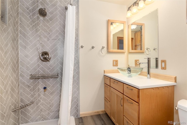 bathroom featuring vanity, hardwood / wood-style floors, toilet, and a shower with shower curtain