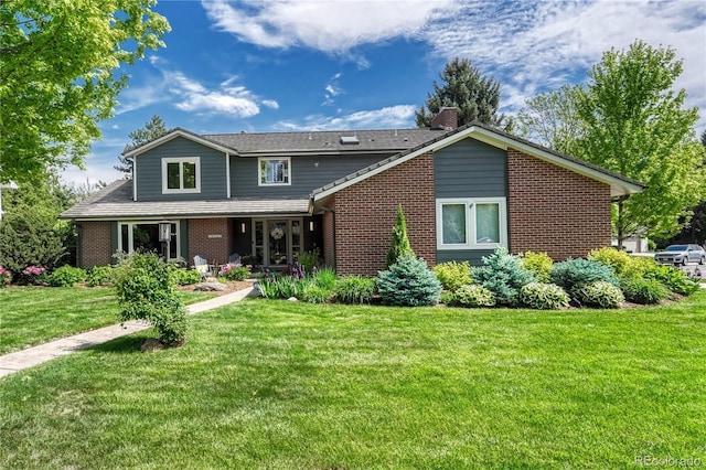 10289 E Berry Dr, Greenwood Village, CO 80111 - rear view of house with a lawn, a chimney, and brick siding