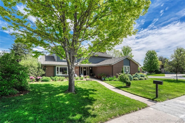 10289 E Berry Dr, Greenwood Village, CO 80111 - view of front facade featuring brick siding and a front yard