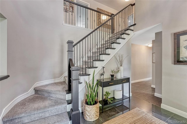 10289 E Berry Dr, Greenwood Village, CO 80111 - stairway with a high ceiling and baseboards