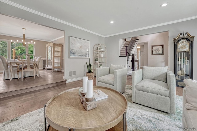 10289 E Berry Dr, Greenwood Village, CO 80111 - living room with stairs, a chandelier, ornamental molding, wood finished floors, and recessed lighting