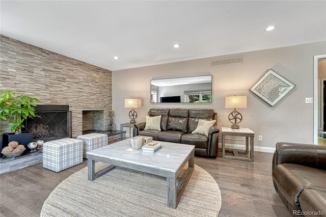 10289 E Berry Dr, Greenwood Village, CO 80111 - living area featuring wood finished floors, recessed lighting, and a large fireplace