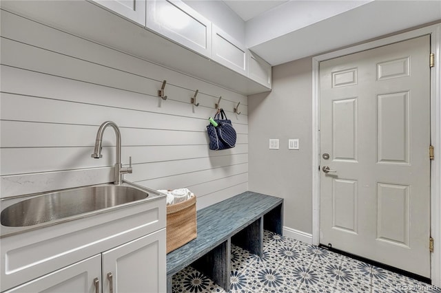 10289 E Berry Dr, Greenwood Village, CO 80111 - mudroom with a sink and wood walls