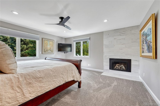 10289 E Berry Dr, Greenwood Village, CO 80111 - carpeted bedroom featuring multiple windows, a fireplace, recessed lighting, and ceiling fan