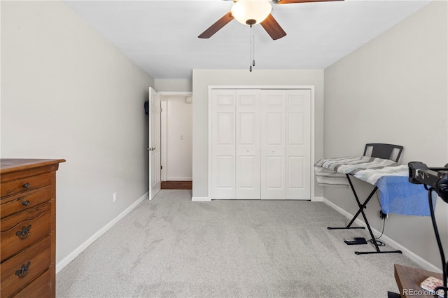 bedroom with light carpet, a closet, and ceiling fan