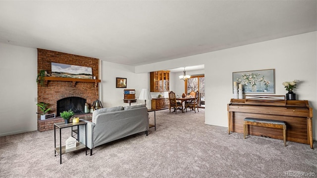 living room featuring light carpet, a fireplace, and a notable chandelier