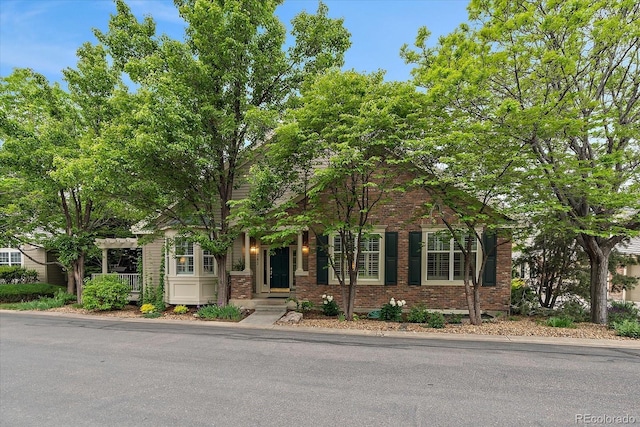 4545 S Monaco St Unit 243, Denver, CO 80237 - obstructed view of property featuring brick siding