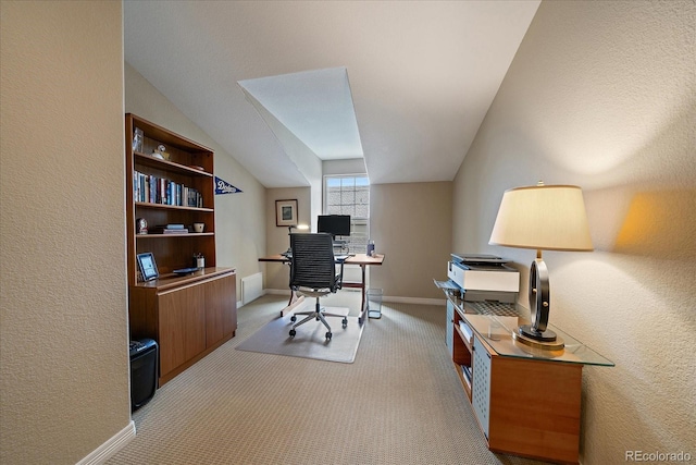 4545 S Monaco St Unit 243, Denver, CO 80237 - carpeted home office featuring lofted ceiling, a textured wall, and baseboards
