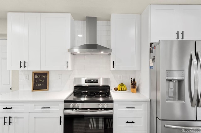2313 S Raleigh St, Denver, CO 80219 - kitchen with appliances with stainless steel finishes, wall chimney exhaust hood, light countertops, backsplash, and white cabinets