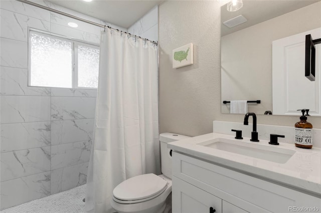 2313 S Raleigh St, Denver, CO 80219 - bathroom featuring vanity and a tile shower