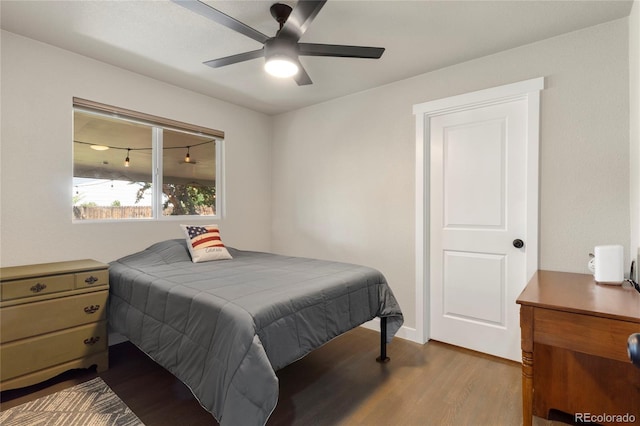 2313 S Raleigh St, Denver, CO 80219 - bedroom with dark wood finished floors and ceiling fan