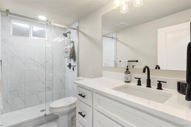 2313 S Raleigh St, Denver, CO 80219 - full bath with marble look tiles, vanity, and a marble finish shower