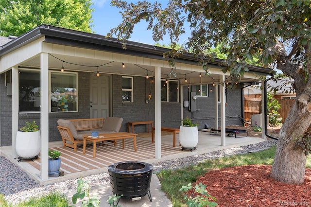 2313 S Raleigh St, Denver, CO 80219 - view of patio featuring a fire pit