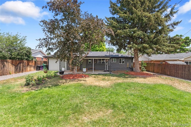 2313 S Raleigh St, Denver, CO 80219 - rear view of house featuring a fenced backyard