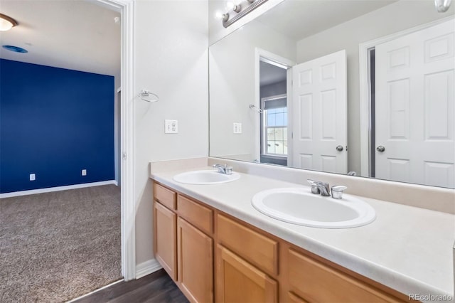 bathroom with vanity and hardwood / wood-style flooring