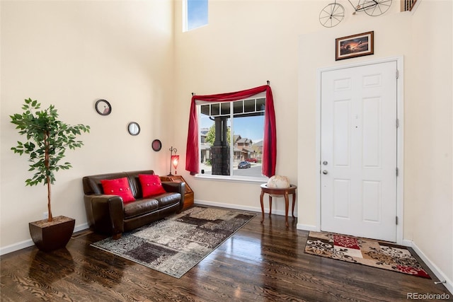 11460 W Tanforan Cir, Littleton, CO 80127 - foyer featuring wood finished floors, a towering ceiling, and baseboards