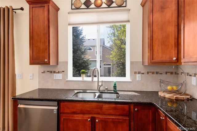 11460 W Tanforan Cir, Littleton, CO 80127 - kitchen with stainless steel dishwasher, a sink, tasteful backsplash, and dark stone counters