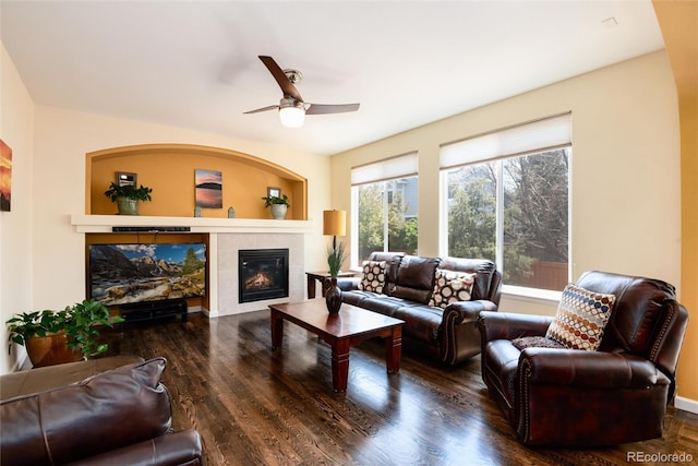 11460 W Tanforan Cir, Littleton, CO 80127 - living room featuring a fireplace, a ceiling fan, and wood finished floors