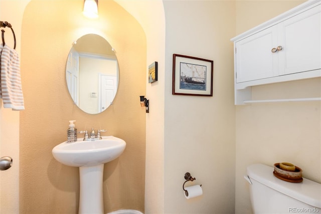 11460 W Tanforan Cir, Littleton, CO 80127 - half bath featuring toilet and a sink
