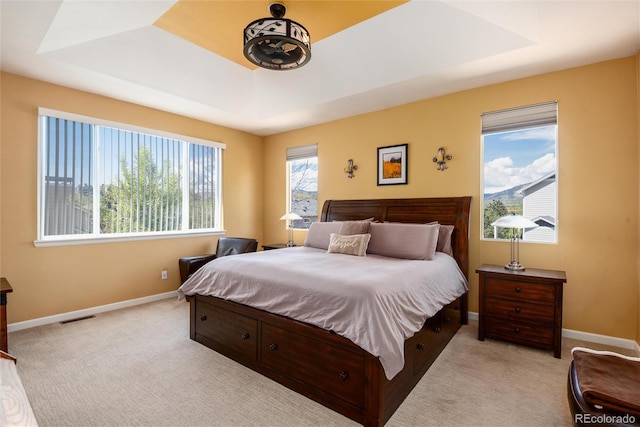 11460 W Tanforan Cir, Littleton, CO 80127 - bedroom with a raised ceiling, light colored carpet, and baseboards