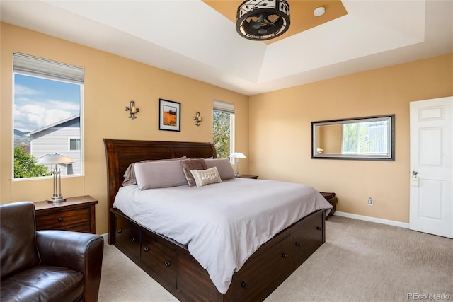11460 W Tanforan Cir, Littleton, CO 80127 - bedroom with a raised ceiling, light colored carpet, and baseboards