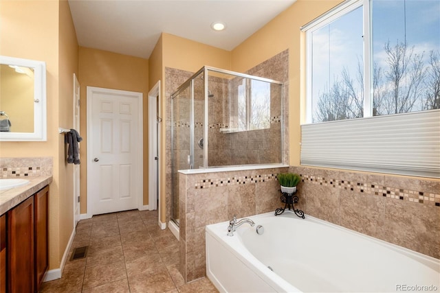 11460 W Tanforan Cir, Littleton, CO 80127 - bathroom with a shower stall, vanity, a bath, and tile patterned flooring