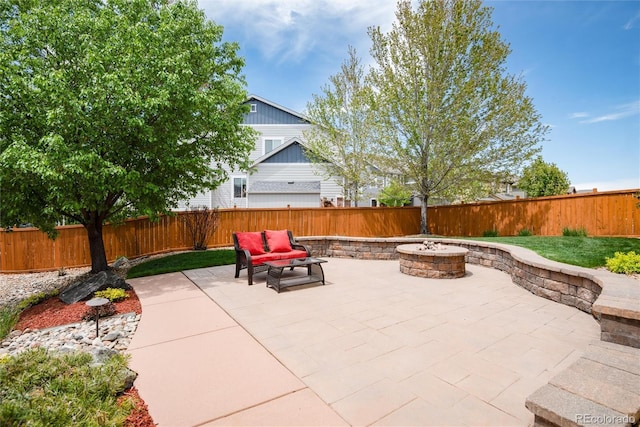 11460 W Tanforan Cir, Littleton, CO 80127 - view of patio with a fire pit and a fenced backyard