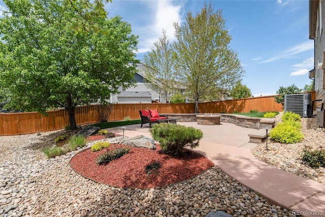 11460 W Tanforan Cir, Littleton, CO 80127 - fenced backyard with a patio, central AC, and an outdoor fire pit
