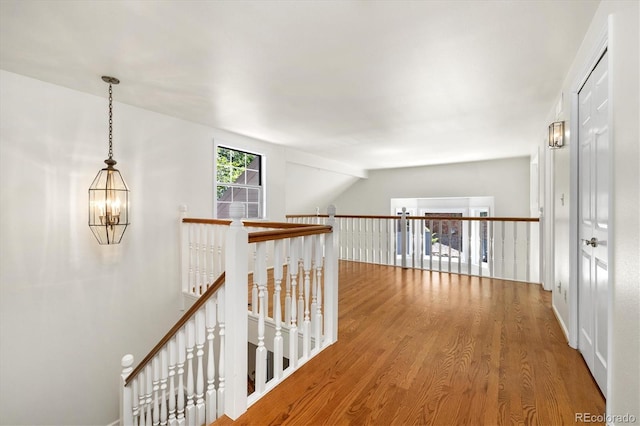 5922 E Briarwood Dr, Centennial, CO 80112 - corridor with an upstairs landing, wood finished floors, and a chandelier