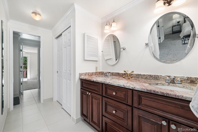 5922 E Briarwood Dr, Centennial, CO 80112 - full bath with double vanity, tile patterned floors, and crown molding