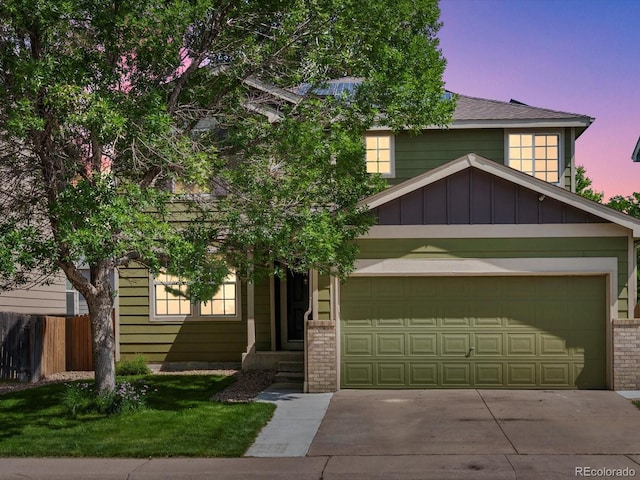 11082 Fillmore Way, Northglenn, CO 80233 - view of front facade with a garage, driveway, and a shingled roof