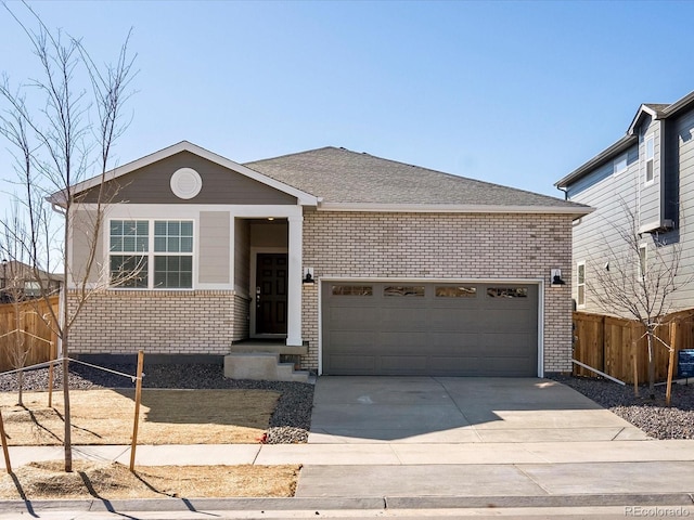 single story home featuring concrete driveway, an attached garage, fence, and brick siding