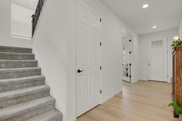 7325 S Waterloo Way, Aurora, CO 80016 - stairs featuring wood finished floors, recessed lighting, and baseboards