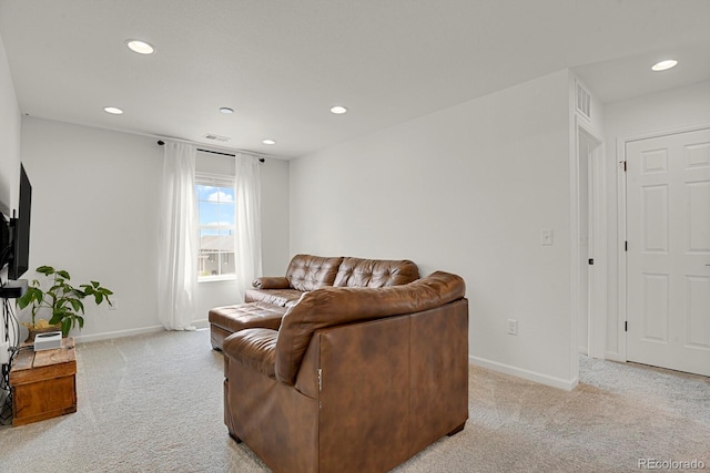 7325 S Waterloo Way, Aurora, CO 80016 - living room featuring light colored carpet, recessed lighting, and baseboards