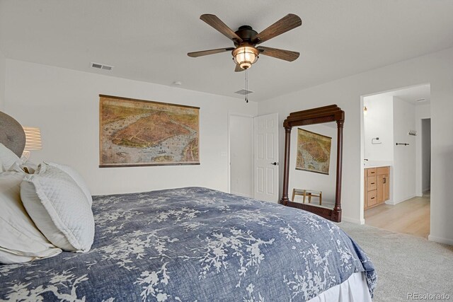 7325 S Waterloo Way, Aurora, CO 80016 - bedroom with carpet floors, ceiling fan, baseboards, and ensuite bath