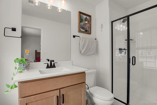 7325 S Waterloo Way, Aurora, CO 80016 - bathroom with vanity, toilet, a stall shower, and ensuite bathroom