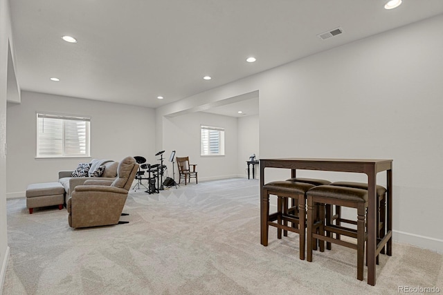 7325 S Waterloo Way, Aurora, CO 80016 - carpeted living room with recessed lighting and baseboards