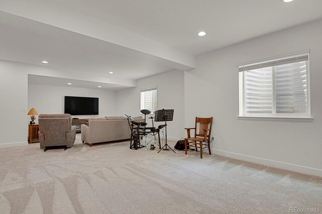 7325 S Waterloo Way, Aurora, CO 80016 - sitting room with light colored carpet, baseboards, and recessed lighting