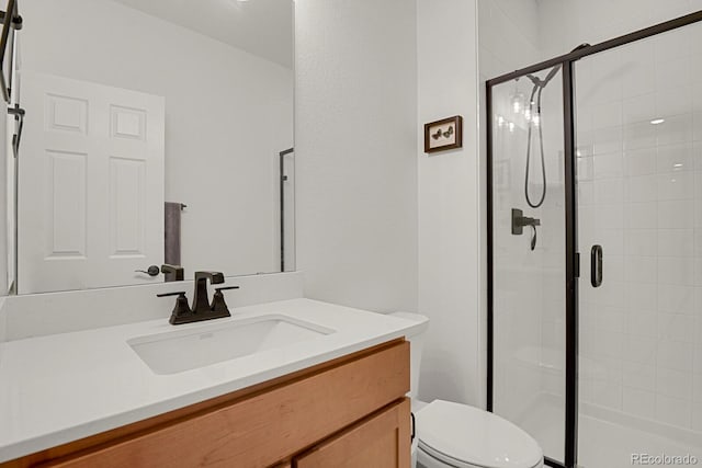 7325 S Waterloo Way, Aurora, CO 80016 - bathroom with toilet, a shower stall, and vanity
