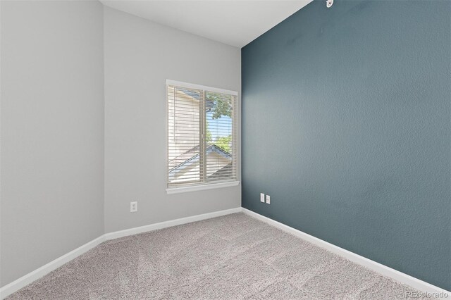 8707 E Florida Ave Unit 614, Denver, CO 80247 - empty room with carpet flooring and baseboards