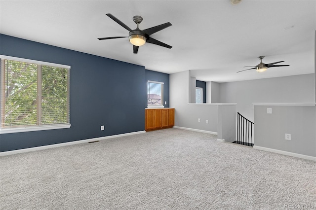 8707 E Florida Ave Unit 614, Denver, CO 80247 - empty room featuring a ceiling fan, carpet floors, and baseboards