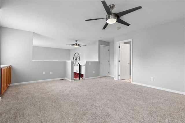 8707 E Florida Ave Unit 614, Denver, CO 80247 - unfurnished living room with carpet floors, ceiling fan, and baseboards