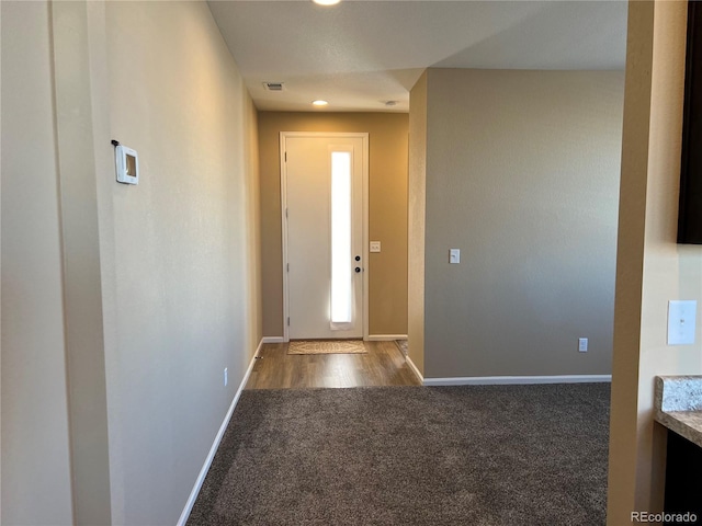 entryway with carpet flooring